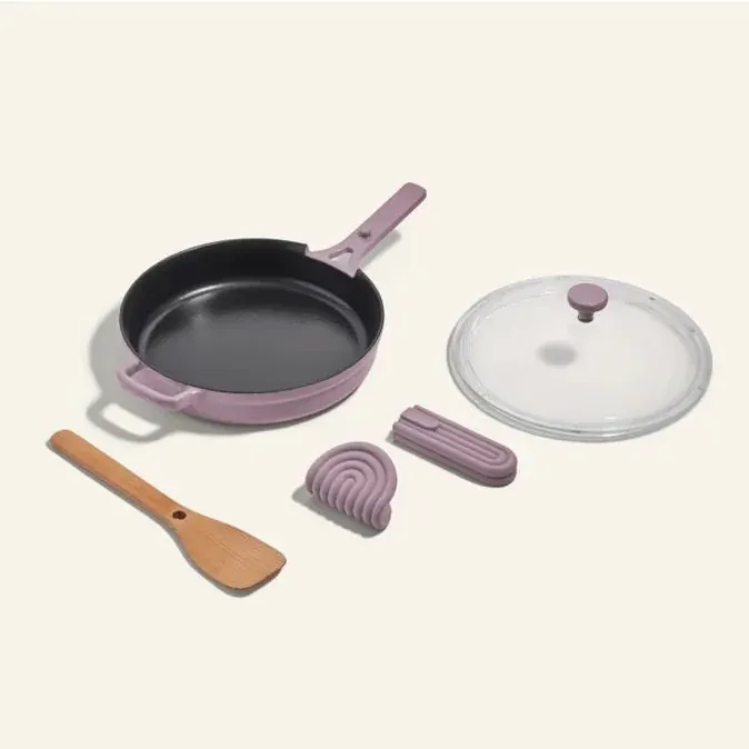 Pink nonstick skillet set with glass lid and wooden spatula
