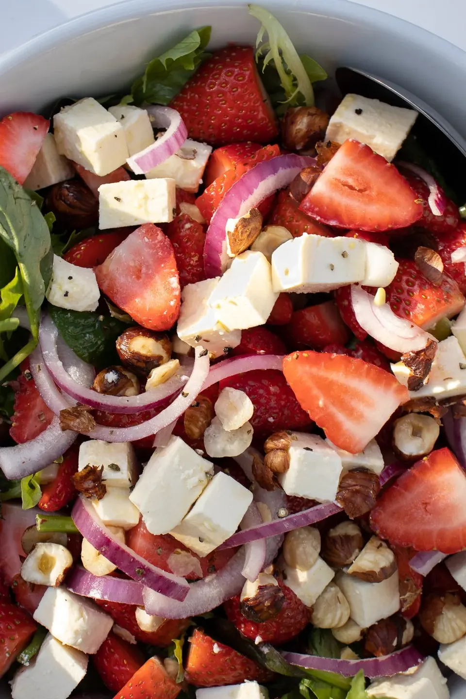 Strawberry feta salad with red onion and hazelnuts