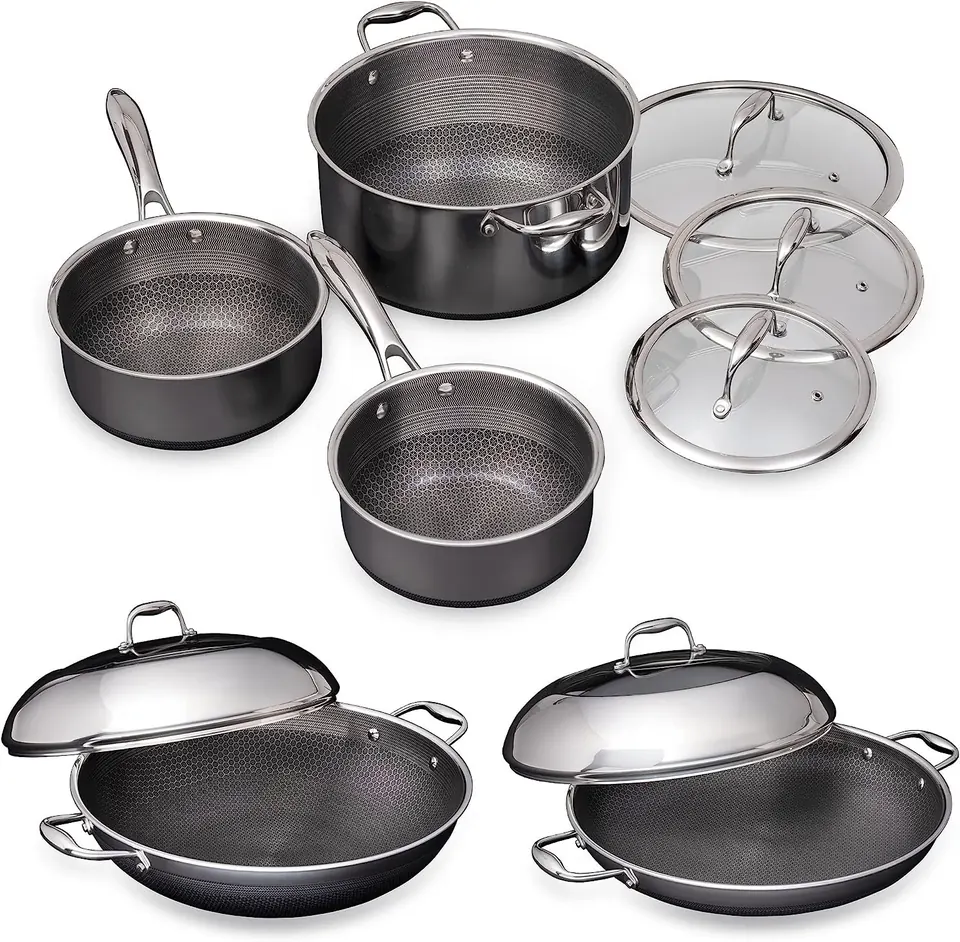 Stainless steel cookware set with pots, pans, and glass lids