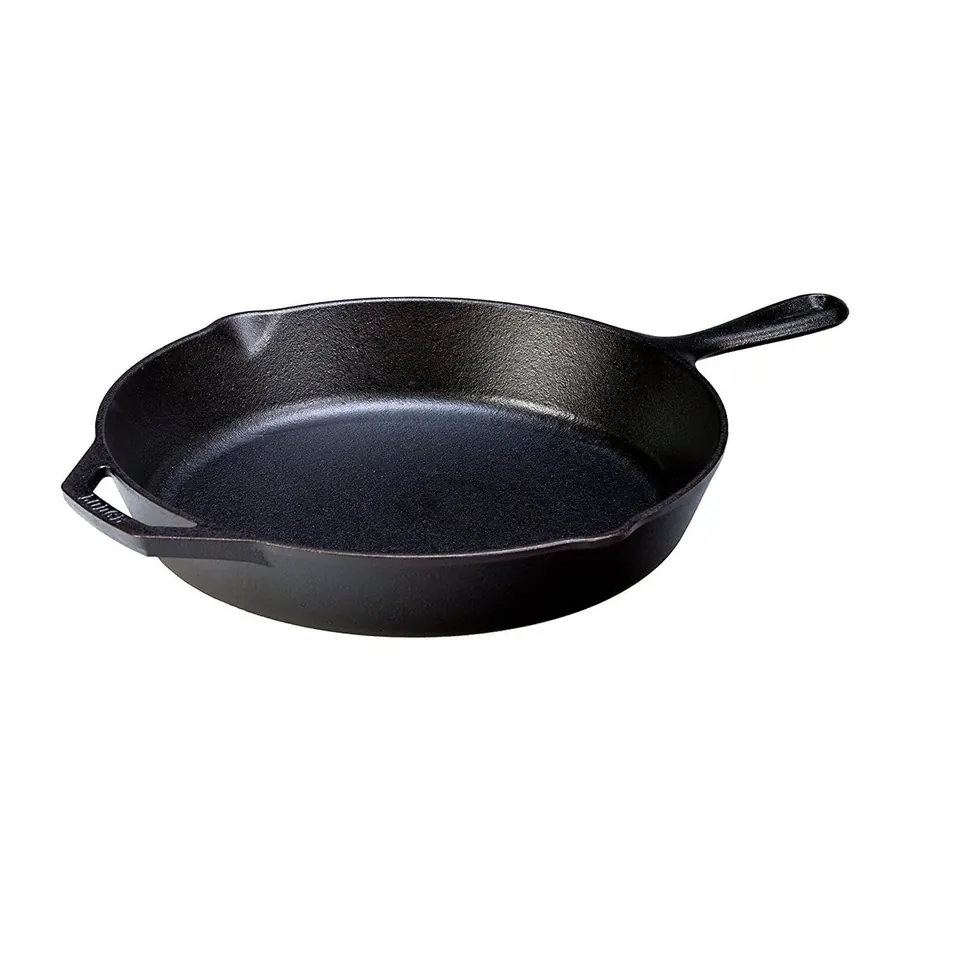 Black cast iron skillet on white background