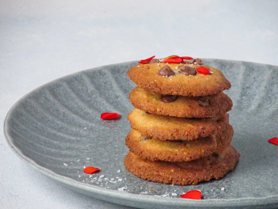 Stack of chocolate chip macadamia cookies on gray plate