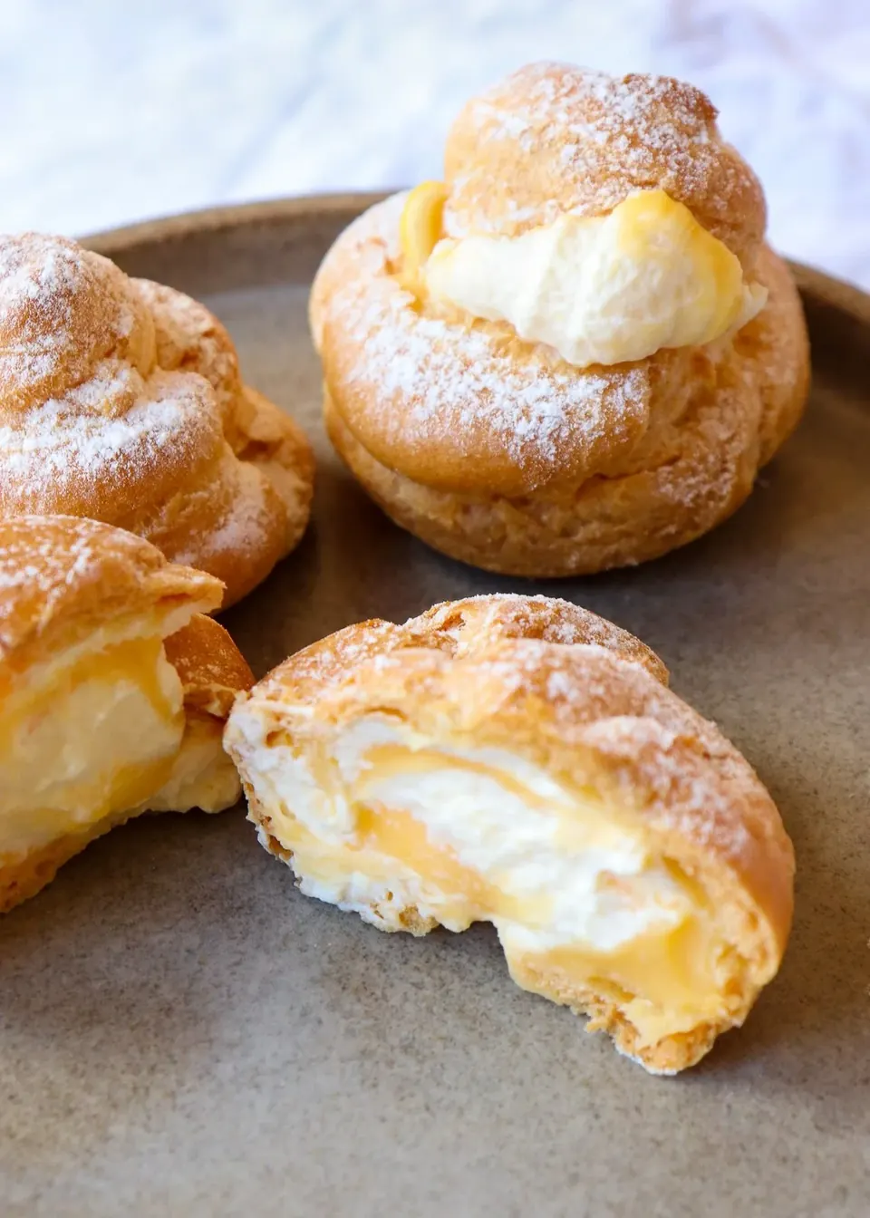 profiteroles filled with cream and lemon curd