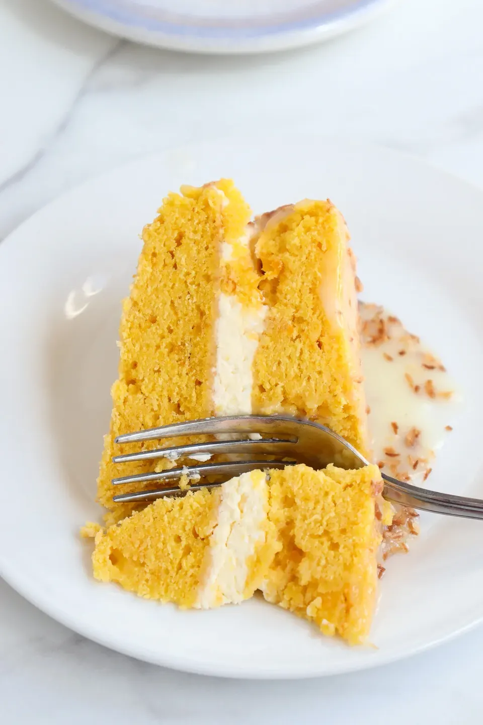 pumpkin coconut cake sliced with fork