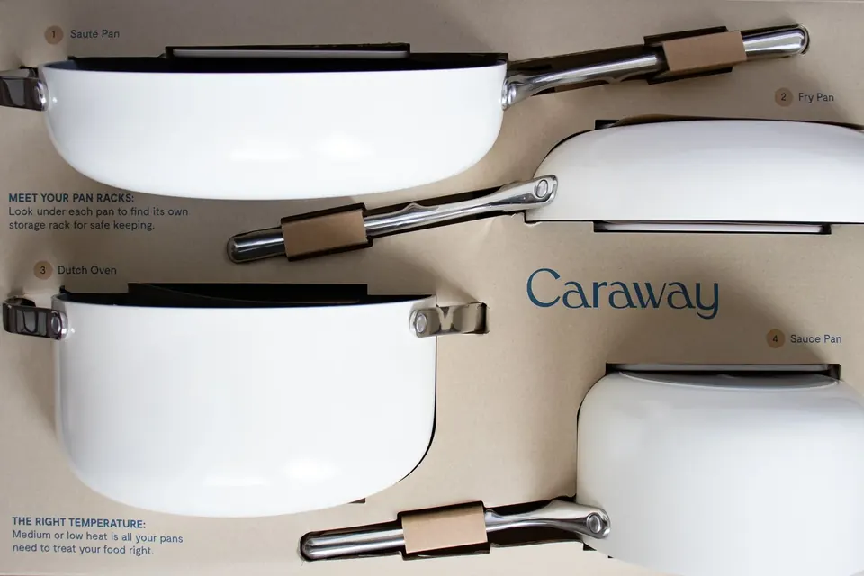 White Caraway cookware set arranged neatly in branded packaging