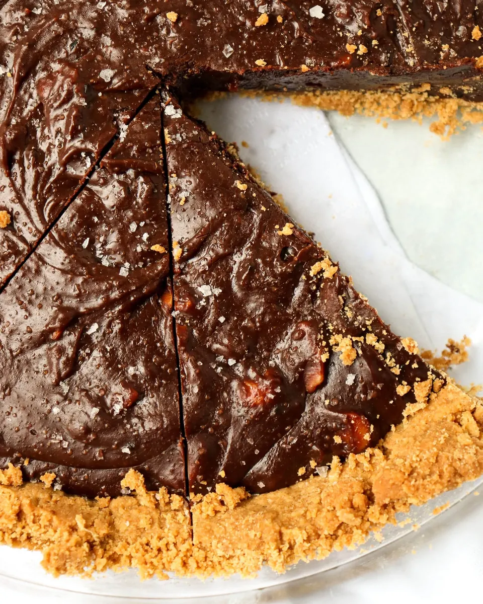 Chocolate macadamia pie with glossy filling and crumb crust