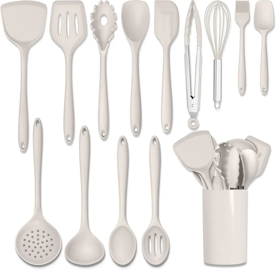 White silicone cooking utensils set with spatulas, whisk, tongs, and holder