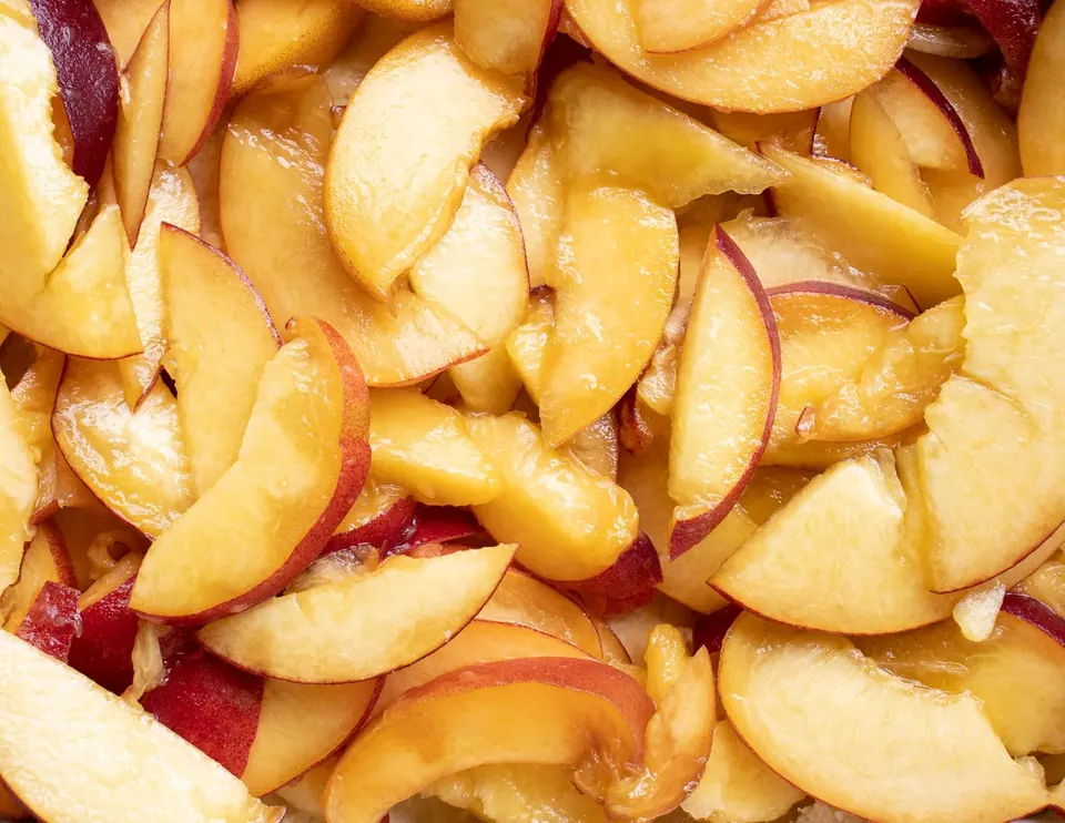 Close-up of sliced peaches for peach crumble bars