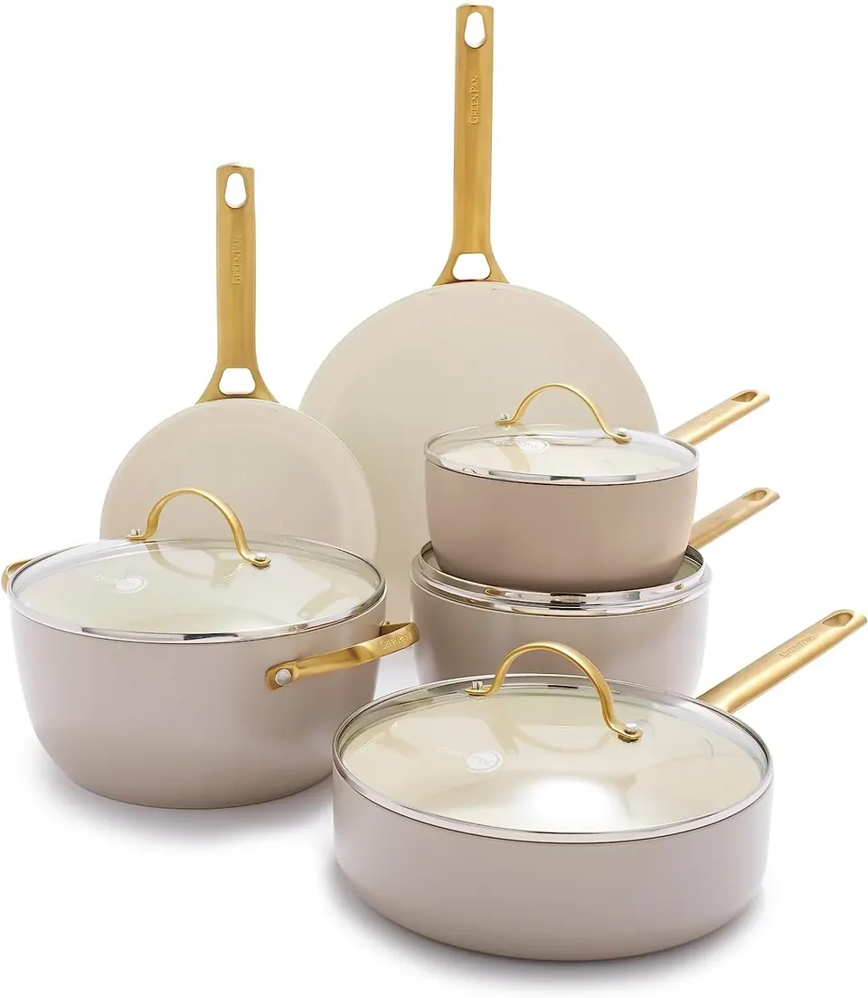 Cream cookware set with gold handles and glass lids